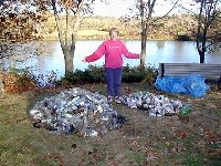 Dona with mountain of collected bottles